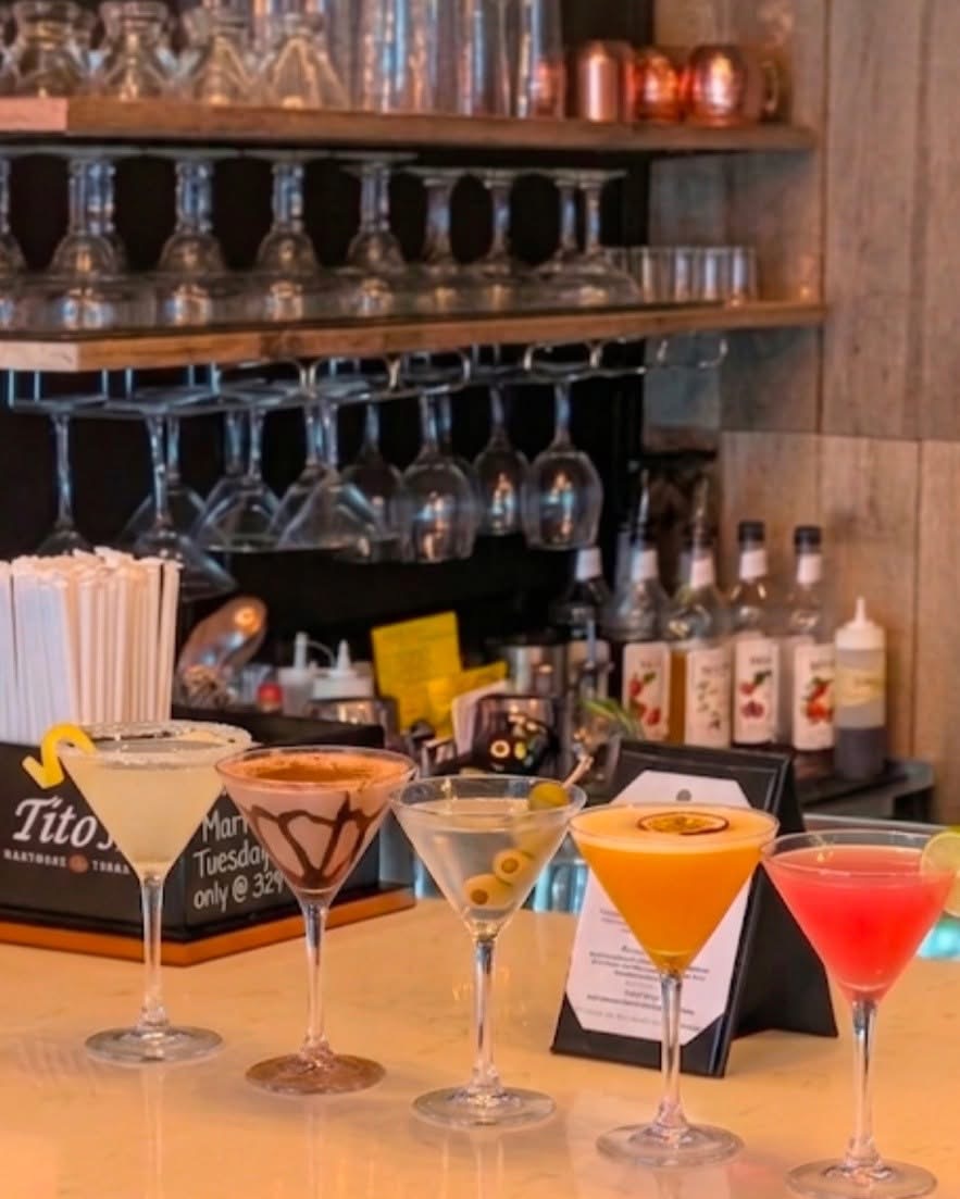 329 martinis lined up on the bar top